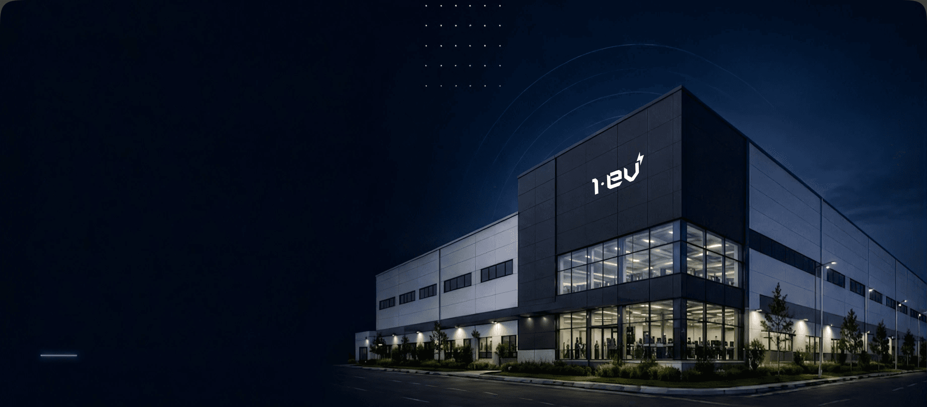 1EV manufacturing facility exterior at night
